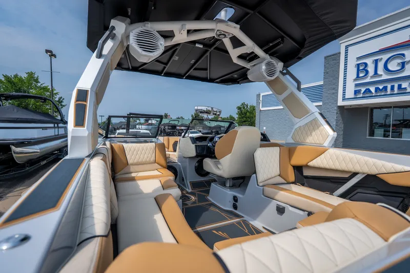 Slide: The Image of 2026 Tigé Z3 boat interior with luxurious seating and modern design at a dealership. - 27