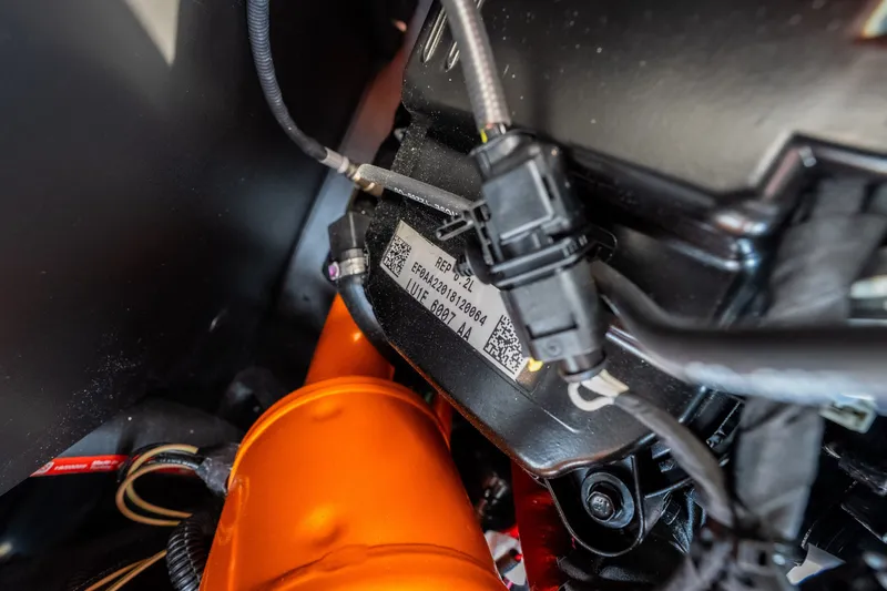 Slide: The Image of Close-up of 2026 Tigé Z3 engine components with wiring and labels. - 64