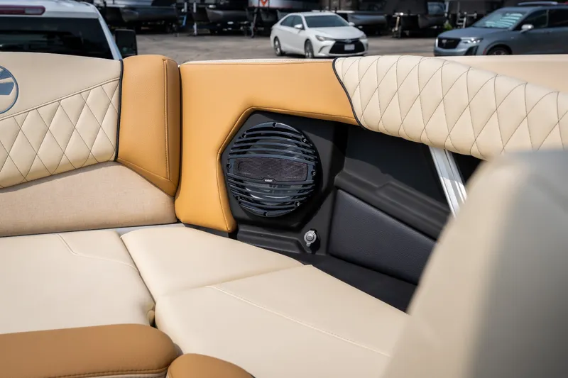 Slide: The Image of 2026 Tigé Z3 boat interior with beige and tan upholstery, featuring a built-in speaker. - 39