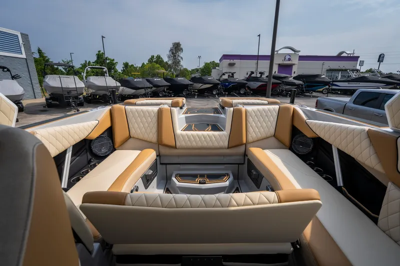 Slide: The Image of Luxurious interior of 2026 Tigé Z3 boat with quilted seating at a dealership. - 55