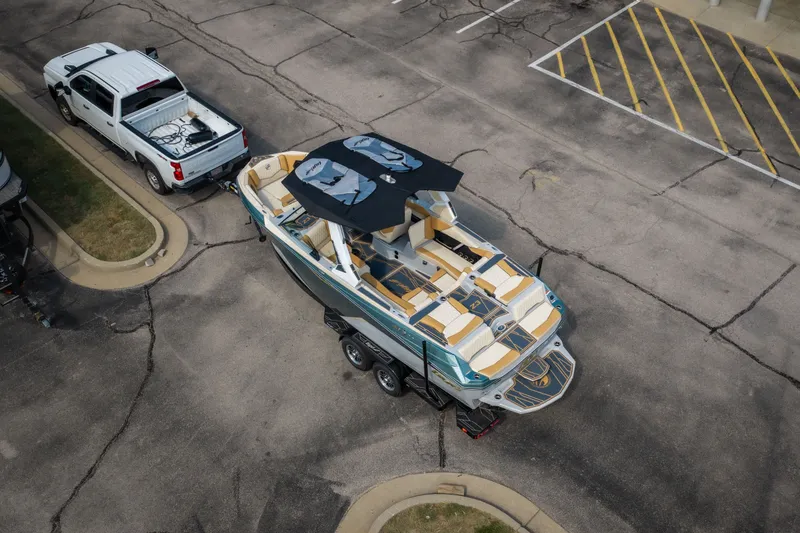 Slide: The Image of Aerial view of 2026 Tigé Z3 boat on trailer, parked beside a white truck. - 7