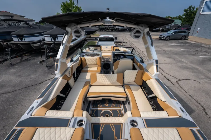 Slide: The Image of 2026 Tigé Z3 boat interior with luxurious seating and modern design in a marina setting. - 68