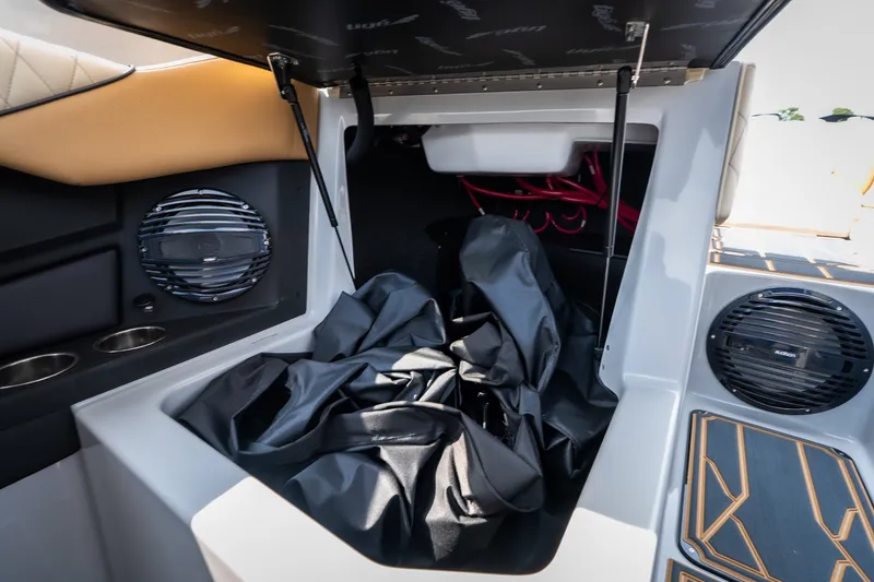 Slide: The Image of 2026 Tigé Z3 boat storage compartment with speakers and upholstery details. - 50