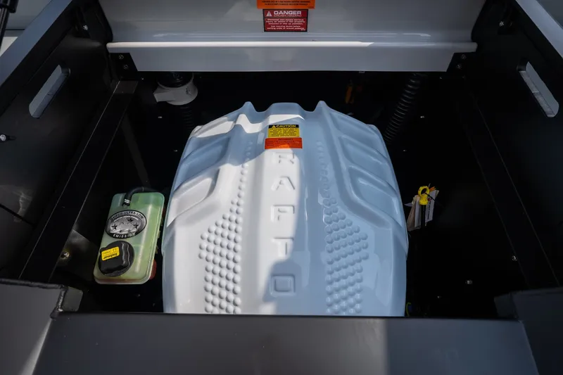 Slide: The Image of Engine compartment of 2026 Tigé Z3 boat, featuring a Raptor engine cover. - 63