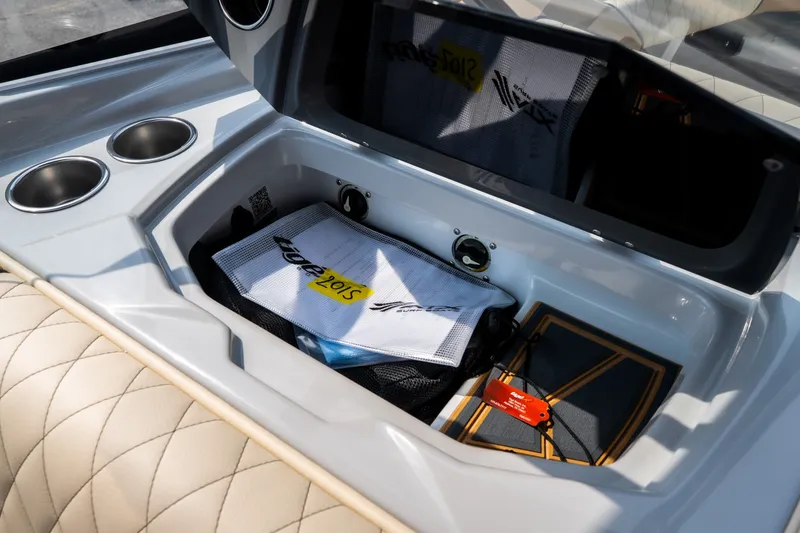 Slide: The Image of Storage compartment in 2026 Tigé Z3 boat with cup holders and accessories. - 47