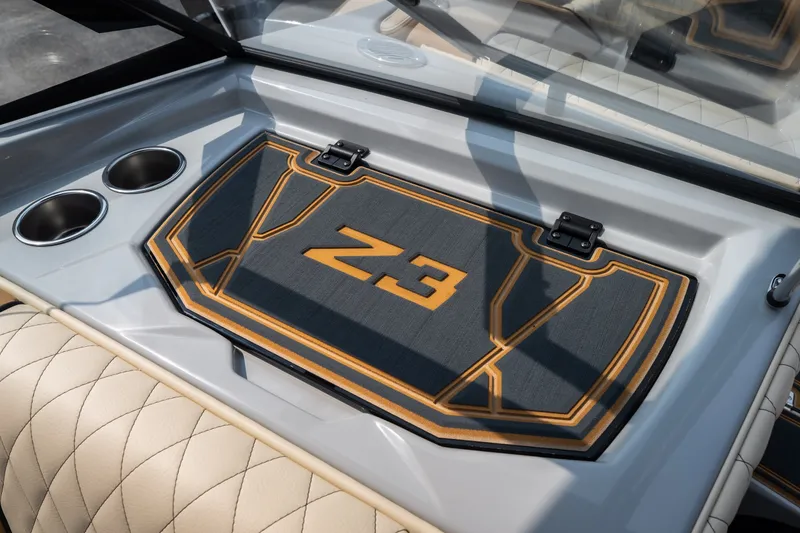 Slide: The Image of 2026 Tigé Z3 boat interior with custom mat and cup holders. - 46