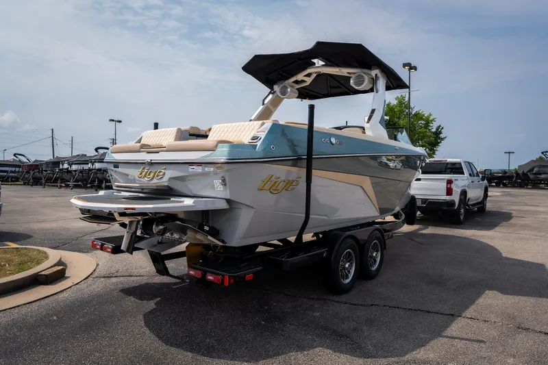 Slide: The Image of 2026 Tigé Z3 boat on trailer in parking lot, featuring sleek design and modern amenities. - 14