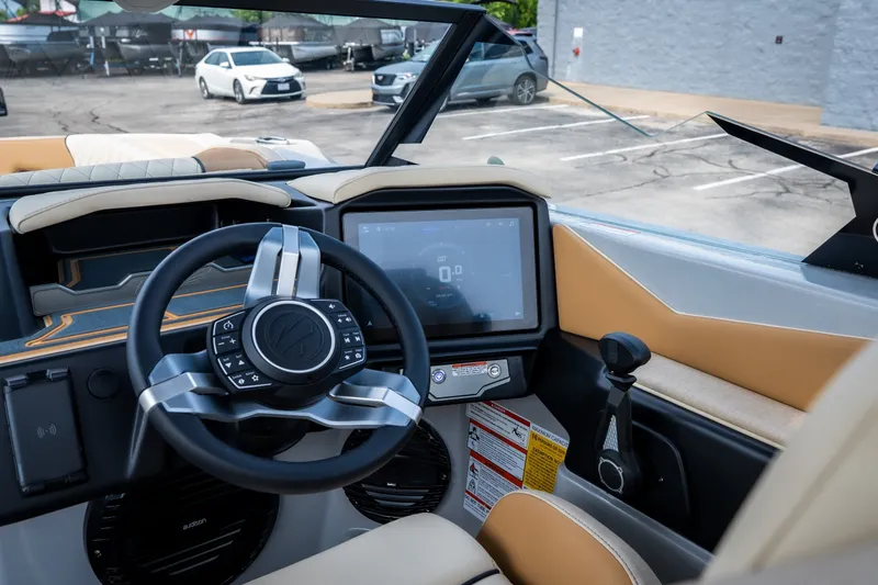 Slide: The Image of Interior view of 2026 Tigé Z3 boat dashboard with modern steering and touchscreen display. - 35
