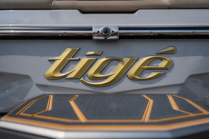 Slide: The Image of 2026 Tigé Z3 boat logo in gold on sleek gray surface. - 17