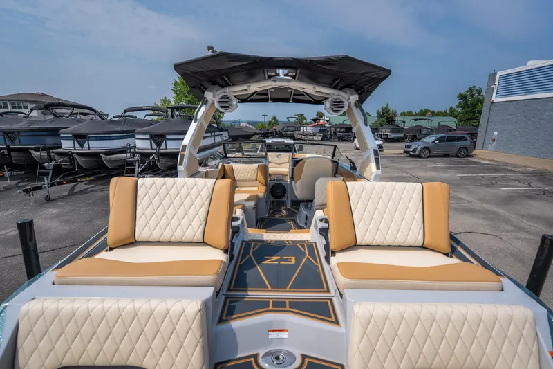 Slide: The Image of 2026 Tigé Z3 boat interior with luxurious seating and modern design in a parking lot. - 25