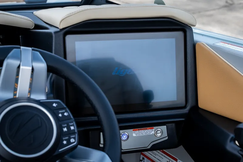 Slide: The Image of 2026 Tigé Z3 boat dashboard with touchscreen and steering wheel controls. - 34