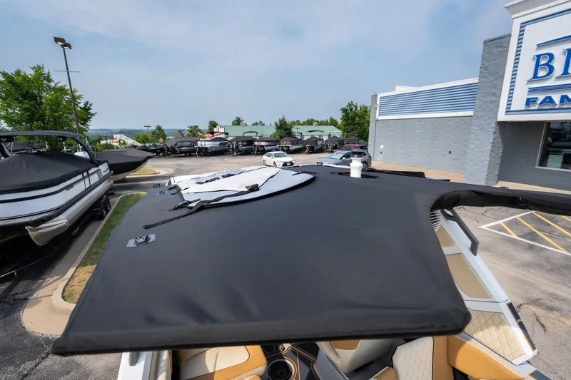 Slide: The Image of 2026 Tigé Z3 boat with cover in dealership parking lot. - 66