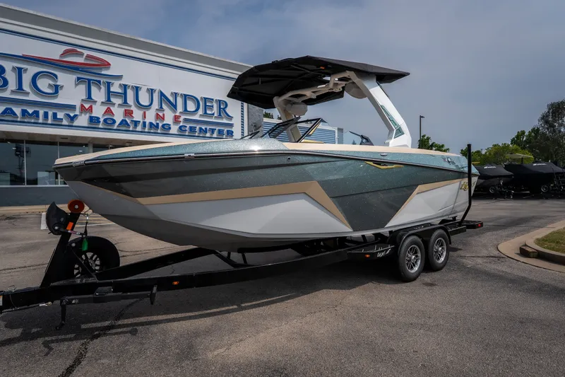 Slide: The Image of 2026 Tigé Z3 boat on trailer at Big Thunder Marine dealership. - 19