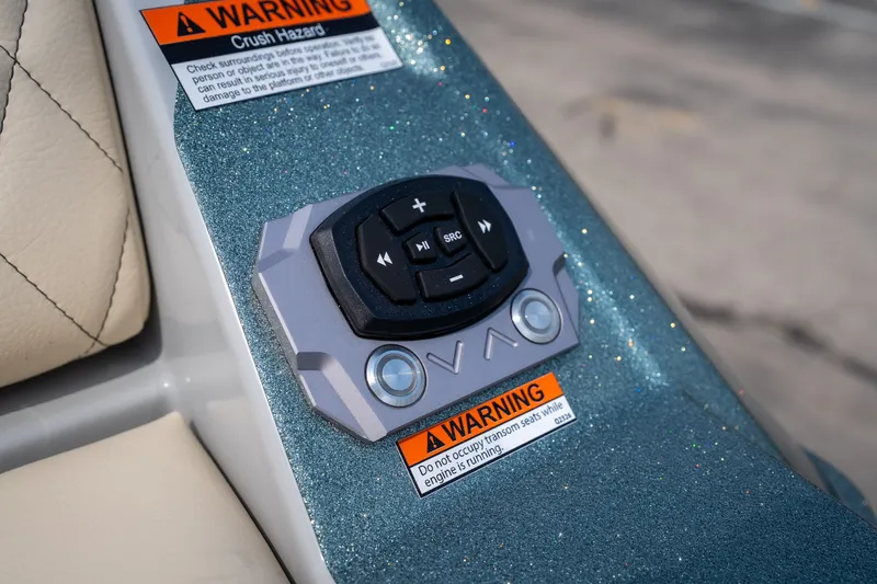 Slide: The Image of Control panel on 2026 Tigé Z3 boat with warning labels and buttons. - 22