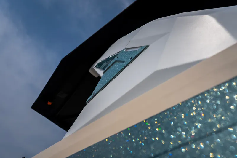 Slide: The Image of Close-up of 2026 Tigé Z3 boat with sparkling blue accents under a clear sky. - 21