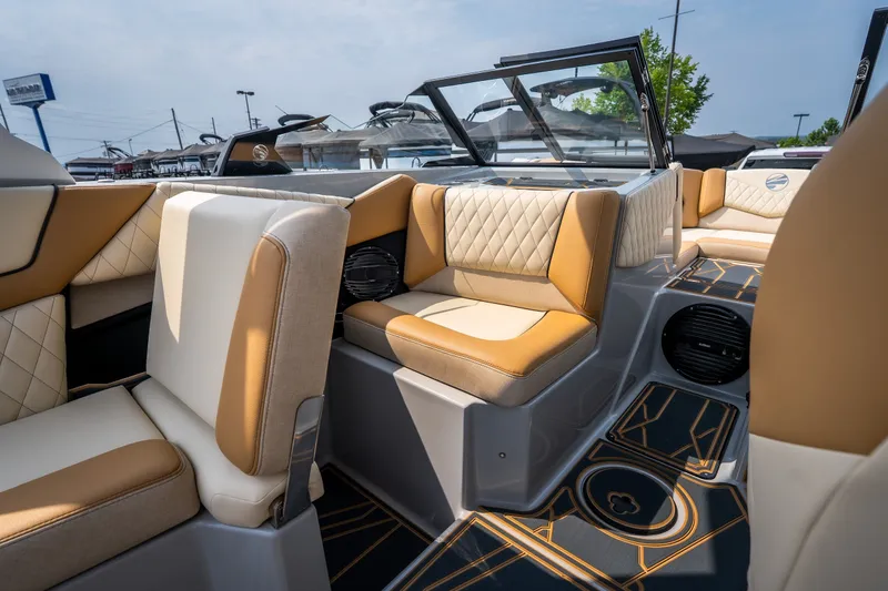 Slide: The Image of Luxurious interior of 2026 Tigé Z3 boat with tan and white seating. - 49