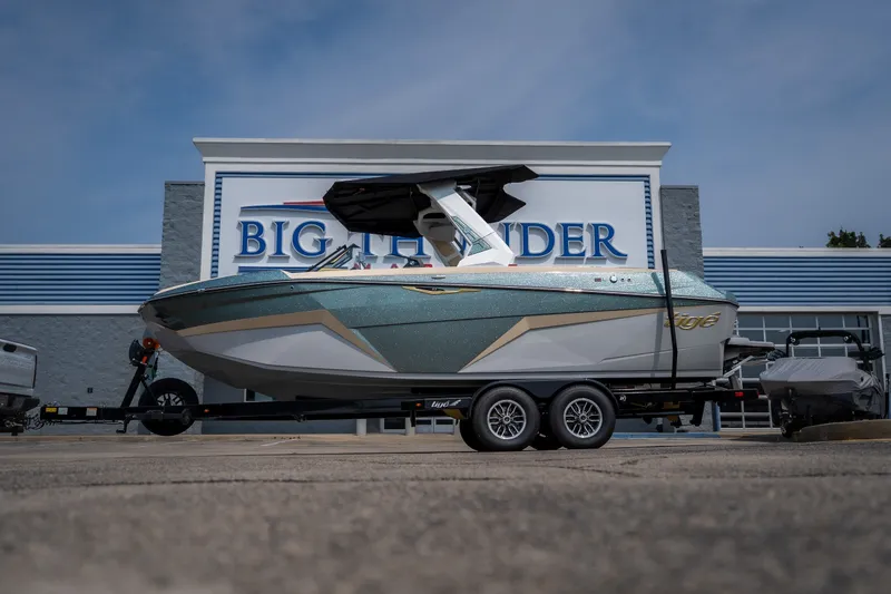 The Image of 2026 Tigé Z3 boat on trailer outside Big Thunder dealership. - 1