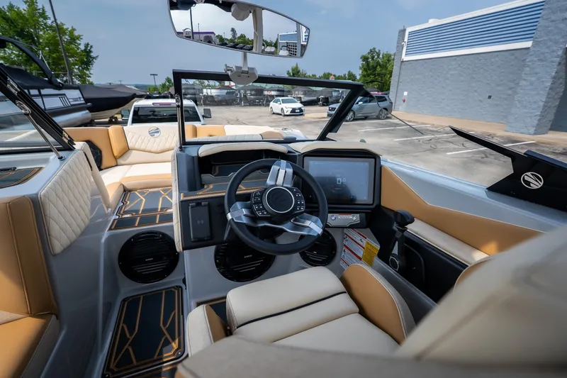 Slide: The Image of Interior view of 2026 Tigé Z3 boat with modern dashboard and luxurious seating. - 28