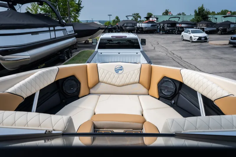 Slide: The Image of 2026 Tigé Z3 boat interior with luxurious seating, parked in a marina. - 38