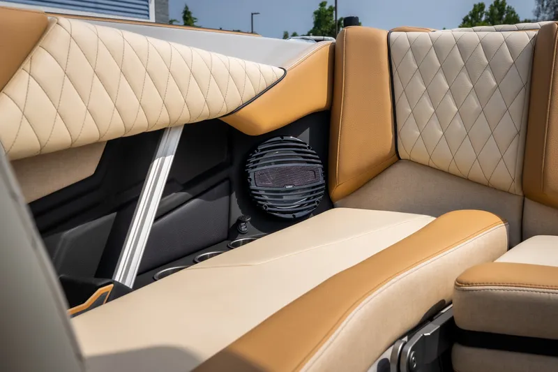 Slide: The Image of 2026 Tigé Z3 boat interior with beige and tan quilted upholstery and speaker detail. - 52