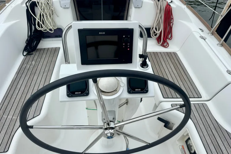 Slide: The Image of Steering wheel and navigation system on 2015 Beneteau Oceanis 31 sailboat. - 7