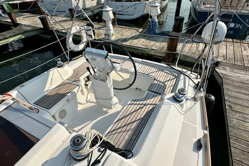 Slide: The Image of Cockpit of a 2015 Beneteau Oceanis 31 sailboat docked at a marina. - 6