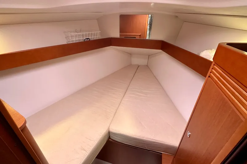 Slide: The Image of Cozy cabin interior of 2015 Beneteau Oceanis 31 sailboat with wooden accents. - 17