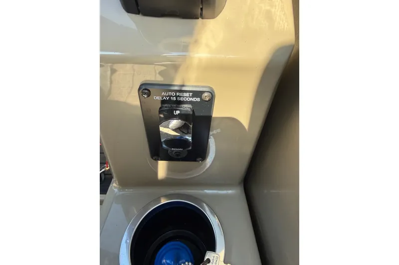 Slide: The Image of Control panel of 2023 Sylvan Mirage X X1 with auto reset switch and cup holder. - 33