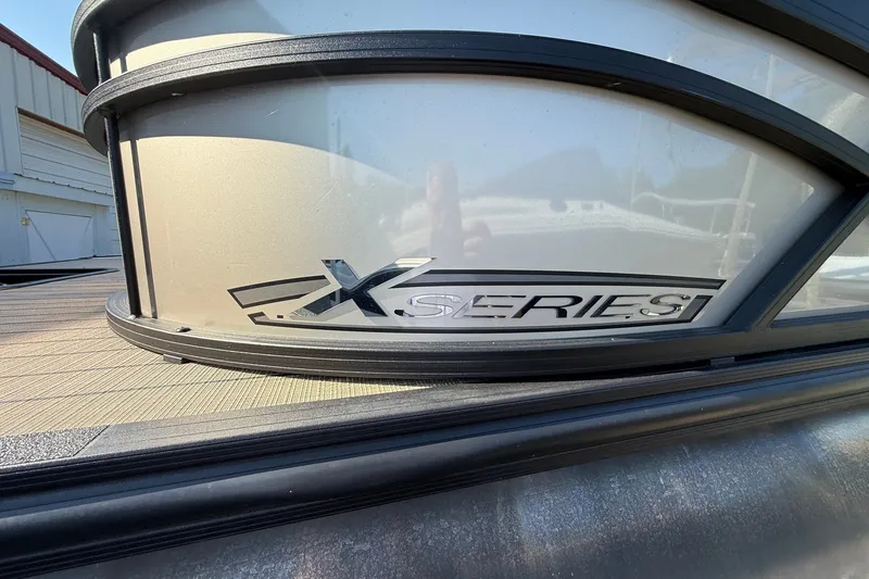 Slide: The Image of 2023 Sylvan Mirage X X1 boat, featuring sleek "X Series" branding on the side panel. - 5