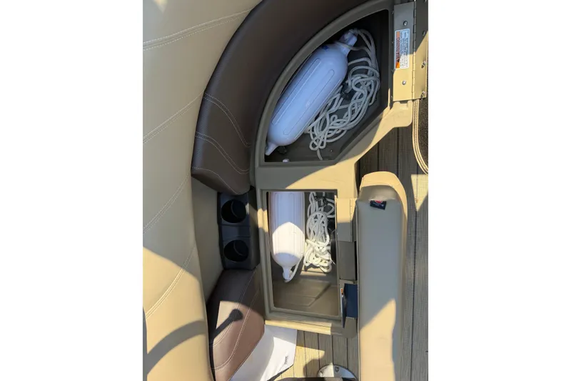 Slide: The Image of 2023 Sylvan Mirage X X1 boat storage compartment with ropes and fender. - 42