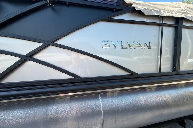 Slide: The Image of 2023 Sylvan Mirage X X1 pontoon boat with sleek design and logo. - 4