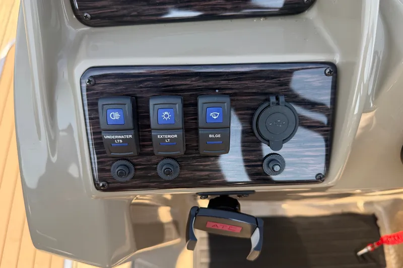 Slide: The Image of Control panel of 2023 Sylvan Mirage X X1 boat with switches for underwater and exterior lights. - 30