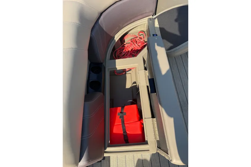 Slide: The Image of Storage compartment in 2023 Sylvan Mirage X X1 boat with red safety gear. - 40