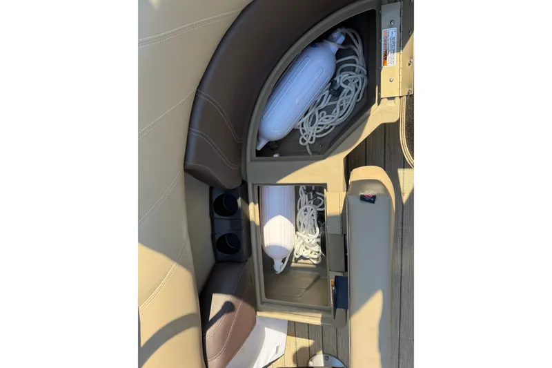 Slide: The Image of 2023 Sylvan Mirage X X1 boat storage compartment with ropes and fender. - 43