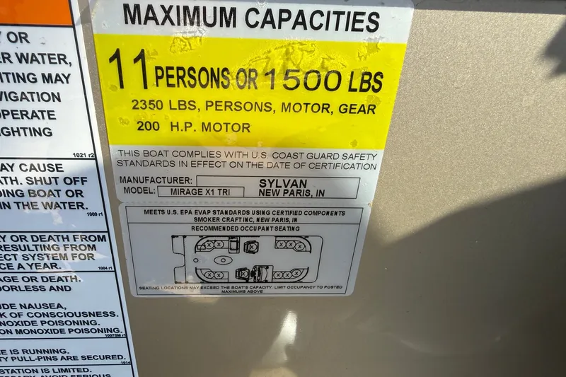 Slide: The Image of 2023 Sylvan Mirage X X1 capacity label: 11 persons or 1500 lbs, 200 HP motor. - 32