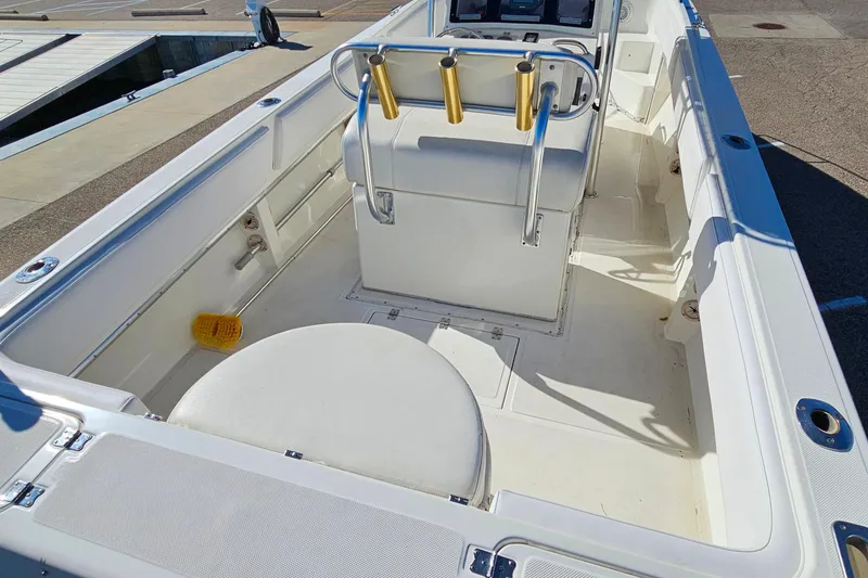 Slide: The Image of 1996 Fountain 31 Tournament Edition boat interior with seating and rod holders. - 13