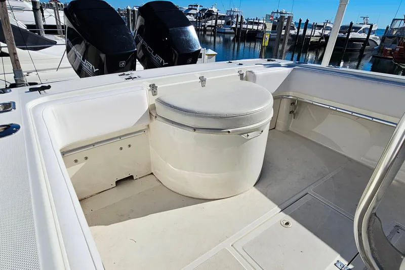 Slide: The Image of 1996 Fountain 31 Tournament Edition boat with dual Mercury engines at a marina. - 12