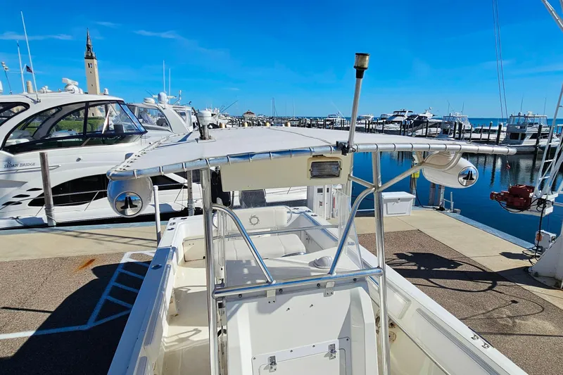 Slide: The Image of 1996 Fountain 31 Tournament Edition boat docked at a marina under clear blue skies. - 30