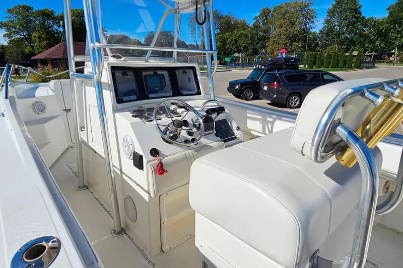 Slide: The Image of 1996 Fountain 31 Tournament Edition boat interior with steering wheel and control panel. - 15