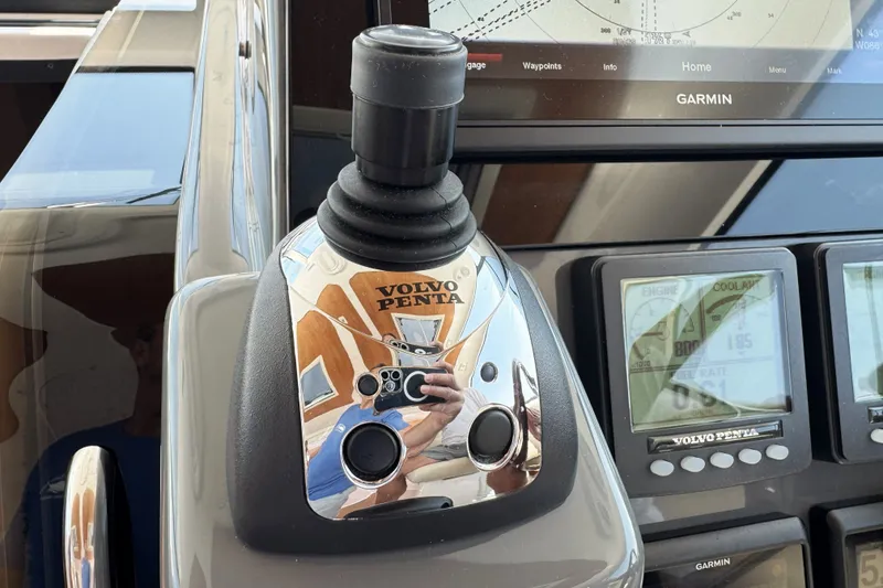 Slide: The Image of Volvo Penta joystick control on 2008 Tiara Yachts 4300 Sovran dashboard with Garmin display. - 18