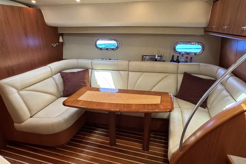 Slide: The Image of Luxurious 2008 Tiara Yachts 4300 Sovran interior with elegant seating and wooden table. - 24