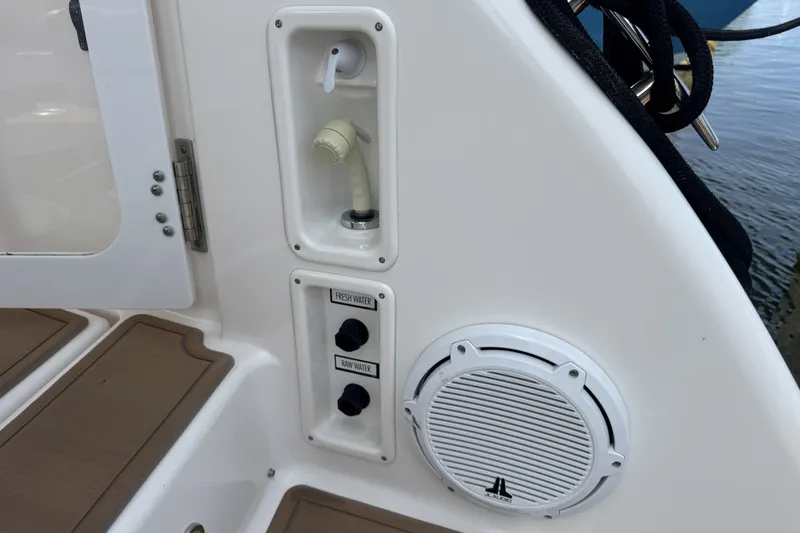 Slide: The Image of 2008 Tiara Yachts 4300 Sovran deck with water controls and speaker. - 46