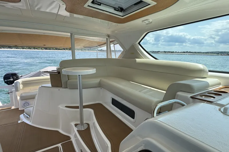 Slide: The Image of 2008 Tiara Yachts 4300 Sovran interior with plush seating and ocean view. - 12