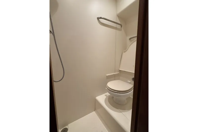 Slide: The Image of 2008 Tiara Yachts 4300 Sovran bathroom with shower and toilet. - 35