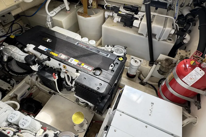 Slide: The Image of Engine room of a 2008 Tiara Yachts 4300 Sovran, featuring detailed mechanical components. - 39