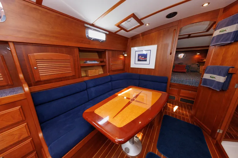 Slide: The Image of Luxurious interior of 2006 Sabre 42 Hard Top Express yacht with wood finish and blue seating. - 34