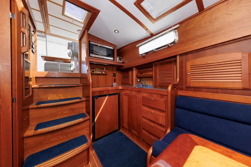 Slide: The Image of Luxurious interior of 2006 Sabre 42 Hard Top Express yacht with wooden cabinetry and seating. - 36