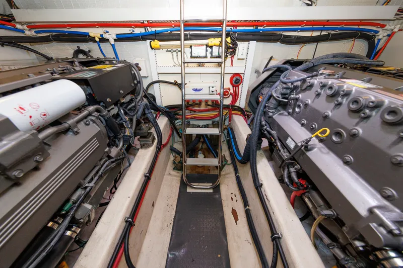 Slide: The Image of Engine room of 2006 Sabre 42 Hard Top Express, showcasing dual engines and wiring. - 53