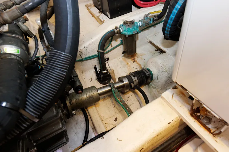 Slide: The Image of Engine compartment of a 2006 Sabre 42 Hard Top Express boat, showing mechanical components. - 57