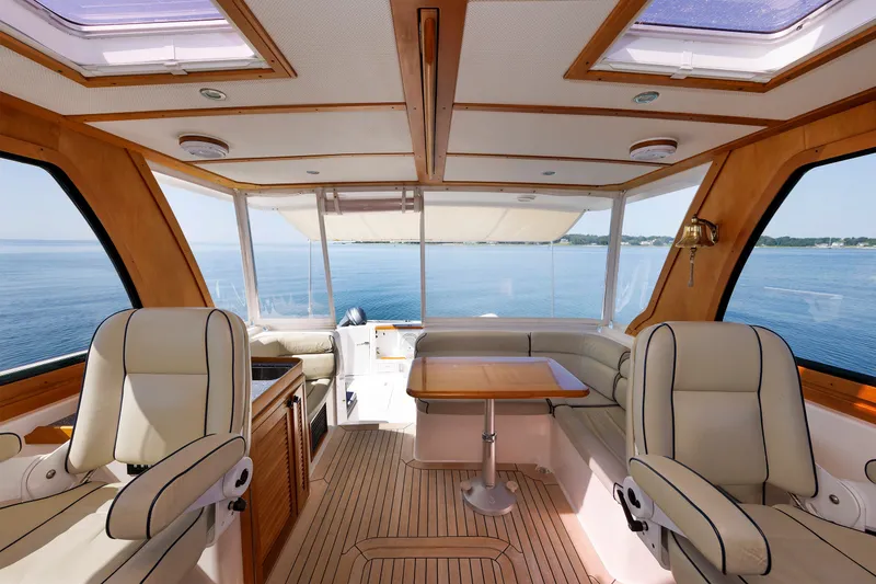 Slide: The Image of Interior of 2006 Sabre 42 Hard Top Express yacht with luxurious seating and ocean view. - 18